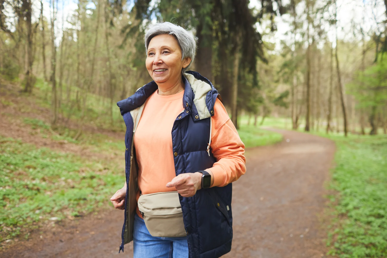 Senior Woman Enjoying a Walk in the Woods